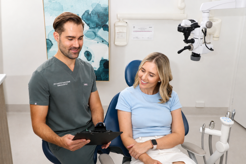 Endodontist discussing root canal treatment options with a patient at Guardian Endodontics in North Brisbane.